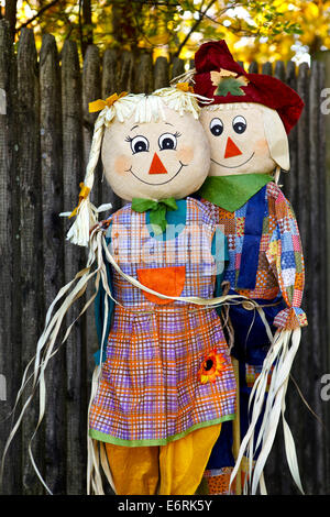 Two happy scarecrows in a garden Stock Photo