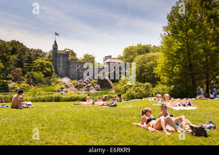 Belvedere Castle, and people sunbathing, Central Park, Manhattan, New York City, New York, USA Stock Photo
