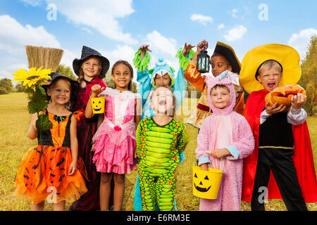 Happy excited kids in Halloween costumes Stock Photo