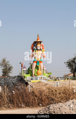 View of a huge tall colourful roadside statue of Hanuman, the Hindu monkey god, at a Hindu temple, Deogarh, Rajasthan, India Stock Photo