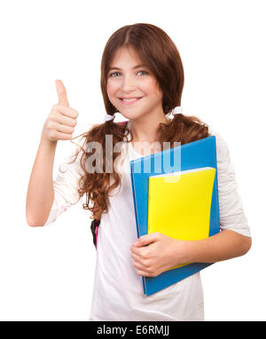 Portrait of happy teen girl well passed exam, cheerful teenager with books gesturing thumbs up isolated on white background Stock Photo