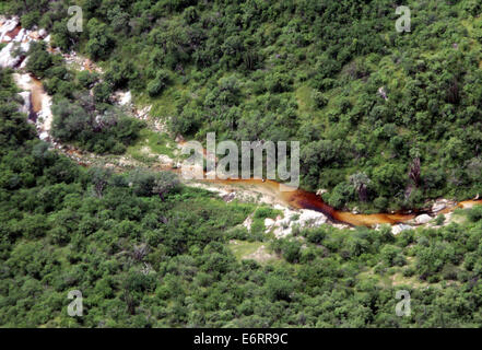 (140830) -- SONORA, Aug. 30, 2014 (Xinhua) -- Image taken on Aug. 12, 2014, showsthe aerial view of the Sonora River after a toxic spill, in Sonora, Mexico. According to the Federal Government, on Aug. 6, 2014, the largest environmental disaster in the mining industry in Mexico was recorded, when 40,000 cubic meters of copper sulfate were spilled into a damm of the miner property of Grupo Mexico, contaminating parts of the Tinajas creek, the Bacanuchi River and the Sonora River. According to a dictum of the Federal Government, the spill occured due to the failure of a mooring of a polyethylene Stock Photo