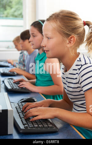 Group Of Elementary School Children In Computer Class Stock Photo - Alamy