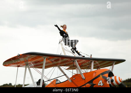 AeroSuperBatics Wingwalkers present the Breitling Wingwalkers Display Team performing at the Shoreham Airshow 2014. 30th August 2014 Stock Photo