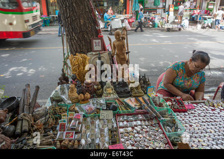 Buddhist amulets for sale at the Tha Prachan Amulet Market in Bangkok, Thailand. Stock Photo