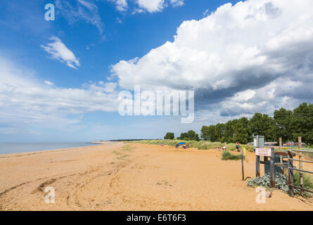 Silver Sands North Beach, Heacham, on the north Norfolk coast with big blue sky and white fluffy clouds Stock Photo