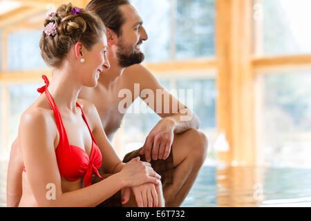 Couple relaxing together at wellness spa pool Stock Photo