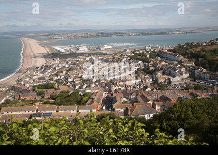 Chesil beach tombolo with high density housing in Fortuneswell, Isle of Portland, Dorset, England Stock Photo
