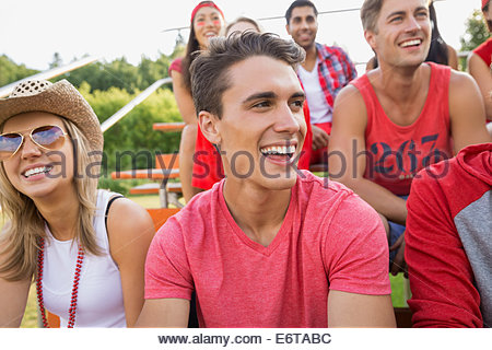 Man laughing at sporting event
