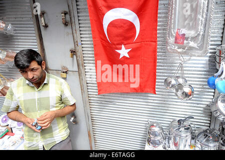 Istanbul, Turkey. 30th Aug, 2014. As elections pass and Recep Tayyip Erdogan has been officially sworn in as Turkish president after winning the country's first public vote for head of state, a great sense of Turkish pride can be seen everywhere in Istanbul. Called the Ay Yildiz meaning the ''moon star' or the Alsancak meaning the red banner the flag of the Turkish Republic can be seen everywhere in a country full of contrasts. © Gail Orenstein/ZUMA Wire/Alamy Live News Stock Photo