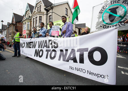 New Port, Wales. 30th Aug, 2014. An Anti-NATO demonstration has taken place in Newport, south Wales on August 30, 2014, ahead of the NATO summit which is due to take place on September 4 and 5, 2014 at the Celtic Manor Resort where 60 heads of state are expected to attend. Early estimates suggest that 600 people marched through Newport city centre to demonstrate against the summit. Credit:  Christopher Middleton/Alamy Live News Stock Photo
