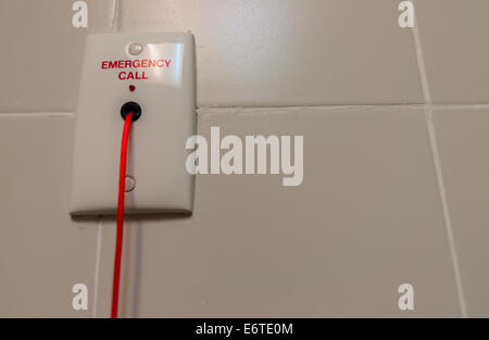 Emergency red rope toilet alarm at hospital Stock Photo