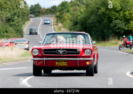 1965 Ford Mustang convertible car on the Fosse Way road, Warwickshire, UK Stock Photo