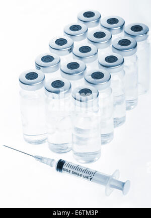 Glass Medicine Vials and botox, hualuronic, collagen or flu Syringe on a white background. Stock Photo