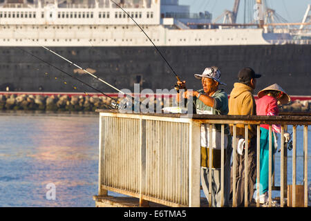 Fishing By The Queen. Long Beach, California. Stock Photo