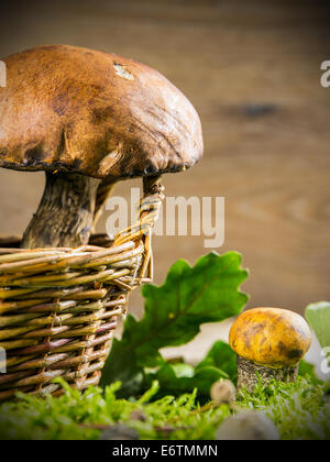 Fresh forest mushrooms against wooden background Stock Photo