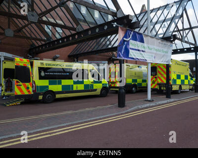 Three Ambulances queuing outside Accident and Emergency Department Wigan Royal Albert Edward Infirmary no room for new patients in the hospital Stock Photo