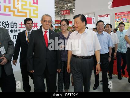 Beijing, China. 31st Aug, 2014. Liu Yunshan (R front), a Standing Committee member of the Communist Party of China Central Committee Political Bureau, arrives at the Turkish pavilion while visiting the Beijing International Book Fair in Beijing, China, Aug. 31, 2014. Credit:  Liu Weibing/Xinhua/Alamy Live News Stock Photo