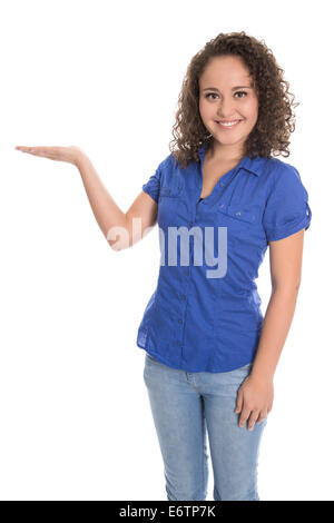 Isolated smiling young woman presenting with palm over white background. Stock Photo