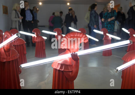Wedel, Germany. 31st Aug, 2014. Visitors look at the sculpture 'Turn to Happiness' of Chinese sculptor Wang Shugang at the exhibition 'Wang Shugang   Beijing Berlin Projekt' at Ernst Barlach Museum in Wedel, Germany, 31 August 2014. The artist will receive the 2014 Ernst Barlach Prize worth 5,000 Euro. Photo: Axel Heimken/dpa/Alamy Live News Stock Photo