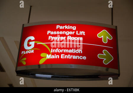 Yogyakarta, Java, Indonesia.  Ambarrukmo Shopping Mall Sign Pointing to Muslim Prayer Room. Stock Photo