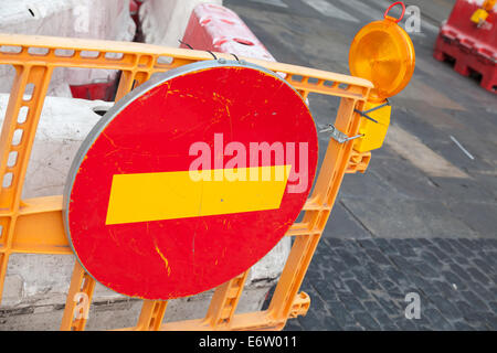 Round red sign No Entry mounted on the road barrier Stock Photo