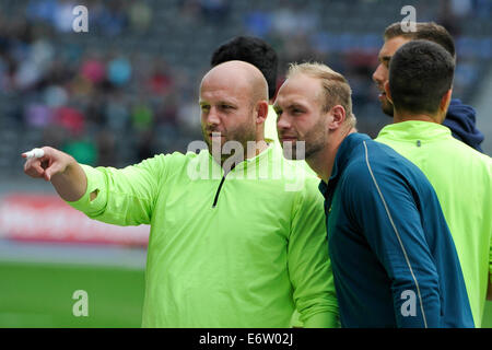 Berlin, Germany. 31st Aug, 2014. Istaf 2014, track-and-field events, Olympiastadion,  Talking, Discus Thrower Piotr Malachowski (POL) and  Robert Harting (GER) right  Credit:   Burghard Schreyer/Alamy Live News Stock Photo