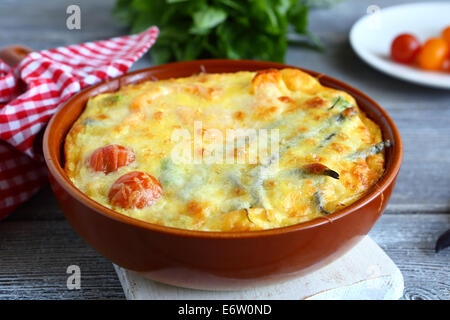 Vegetables baked with cheese in a pan, food closeup Stock Photo