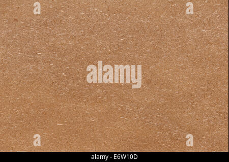 Recycled compressed wood chipboard. Useful for designers as background. Closeup. Stock Photo