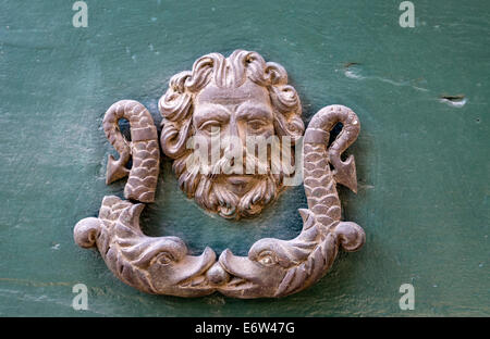 Antique door knocker in the historical old town of Reggio Emilia, Emilia Romagna, North Italy. Stock Photo