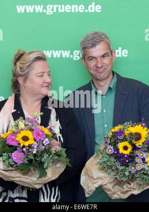 Berlin, Germany. 01st Sep, 2014. The top candidates of Alliance 90/The Greens for the state parliament elections of the German state of Saxony, Antje Hermenau and Volkmar Zschocke, each receive a bunch of flowers before the board meeting of The Greens in Berlin, Germany, 01 September 2014. Photo: Soeren Stache/dpa/Alamy Live News Stock Photo