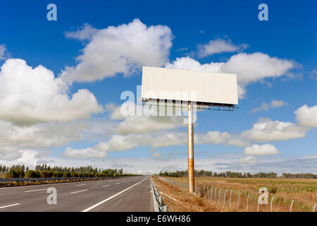 Blank billboard by the highway. Stock Photo