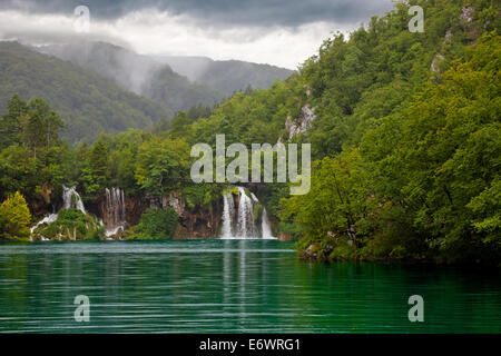 Green lake at Plitvice Lakes National Park in Croatia with waterfall. Stock Photo