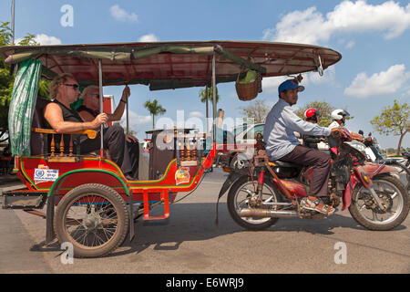 Tourists in Tuk Tuk, Phnom Penh, Cambodia Stock Photo