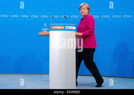 Berlin, Germany. 01st Sep, 2014. German Chancellor Angela Merkel (CDU) arrives for a press conference on the results of the elections in Berlin, Germany, 01 September 2014. Photo: Maurizio Gambarini/dpa/Alamy Live News Stock Photo