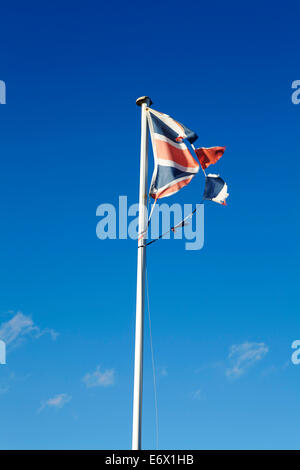 Torn and tattered Union Jack flag against blue cloudy sky Stock Photo ...
