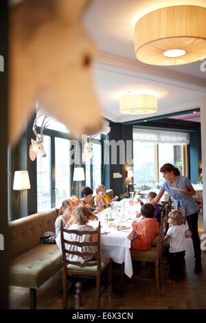 Kids having lunch in the restaurant of Hotel Haus Hirt, Bad Gastein, St. Johann im Pongau, Salzburg, Austria Stock Photo