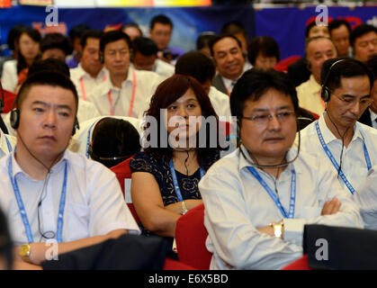 Urumqi, China. 1st Sept, 2014. Guests attend the fourth China-Eurasia Expo in Urumqi, capital of Xinjiang Uygur Autonomous Region, Sept. 1, 2014. The six-day international fair opened on Monday. Credit:  Xinhua/Alamy Live News Stock Photo