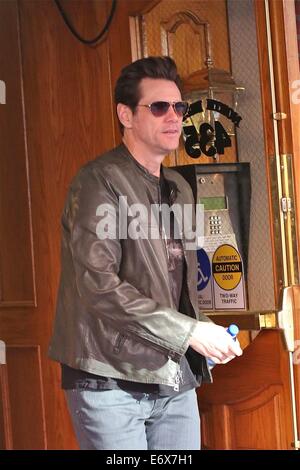 Jim Carrey leaves Bedford Medical Clinic in Beverly Hills wearing a leather bikers jacket and carrying a bottle of water  Featuring: Jim Carrey Where: Los Angeles, California, United States When: 24 Feb 2014 Stock Photo