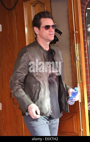 Jim Carrey leaves Bedford Medical Clinic in Beverly Hills wearing a leather bikers jacket and carrying a bottle of water  Featuring: Jim Carrey Where: Los Angeles, California, United States When: 24 Feb 2014 Stock Photo