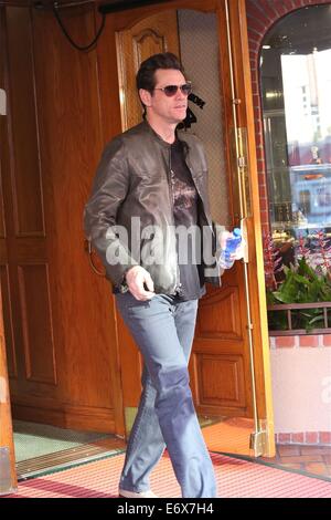 Jim Carrey leaves Bedford Medical Clinic in Beverly Hills wearing a leather bikers jacket and carrying a bottle of water  Featuring: Jim Carrey Where: Los Angeles, California, United States When: 24 Feb 2014 Stock Photo