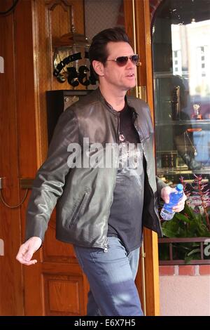 Jim Carrey leaves Bedford Medical Clinic in Beverly Hills wearing a leather bikers jacket and carrying a bottle of water  Featuring: Jim Carrey Where: Los Angeles, California, United States When: 24 Feb 2014 Stock Photo