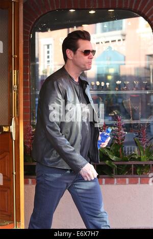 Jim Carrey leaves Bedford Medical Clinic in Beverly Hills wearing a leather bikers jacket and carrying a bottle of water  Featuring: Jim Carrey Where: Los Angeles, California, United States When: 24 Feb 2014 Stock Photo