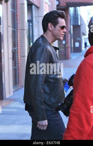 Jim Carrey leaves Bedford Medical Clinic in Beverly Hills wearing a leather bikers jacket and carrying a bottle of water  Featuring: Jim Carrey Where: Los Angeles, California, United States When: 24 Feb 2014 Stock Photo