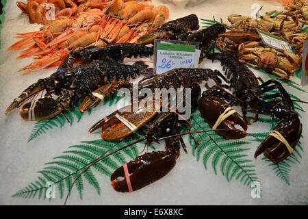 European lobsters at a fish stall in the market hall, Mercat de la Boquería, also Mercat de Sant Josep, Barcelona Stock Photo