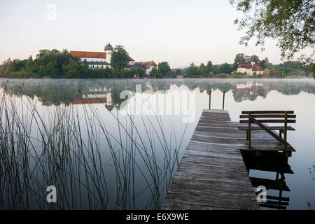 Early morning at Seeon Abbey on an island in Seeoner See Lake, Seeon-Seebruck, Chiemgau, Upper Bavaria, Bavaria, Germany Stock Photo