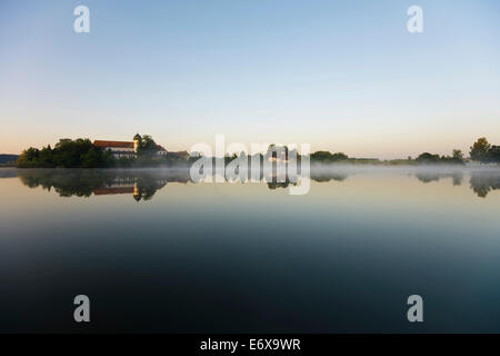 Early morning at Seeon Abbey on an island in Seeoner See Lake, Seeon-Seebruck, Chiemgau, Upper Bavaria, Bavaria, Germany Stock Photo