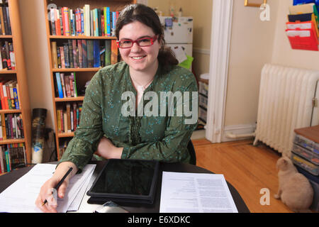 Woman with Asperger syndrome completing her job applications Stock Photo