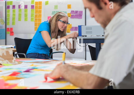 Engineering student setting up power supply in engineering fabrication lab the man with Aspergers Stock Photo