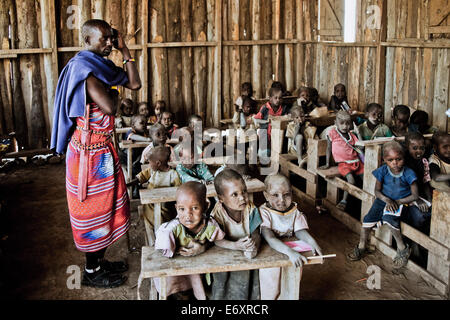 Children and teacher in a Massai village school, Kenya, Africa Stock Photo